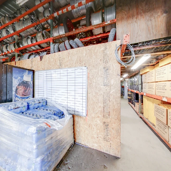 Recycling facility with stacked materials and equipment.