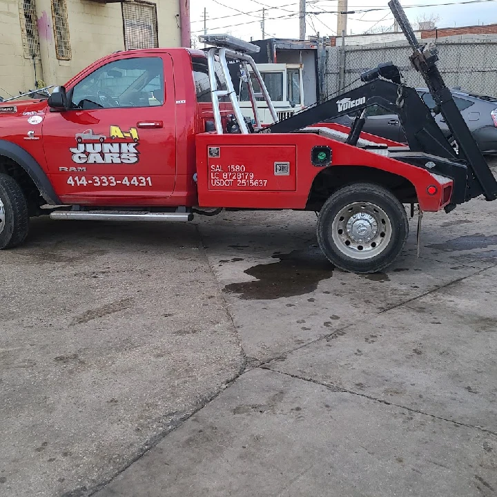 Red tow truck of A-1 Junk Cars Milwaukee.