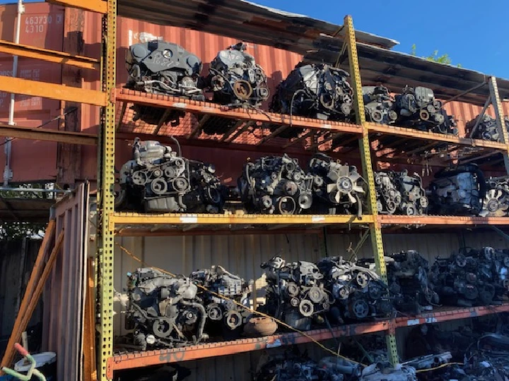 Rows of engine parts stacked on metal shelves.