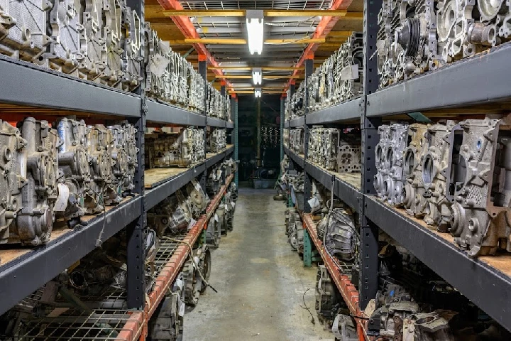 Rows of stacked automotive parts in storage.