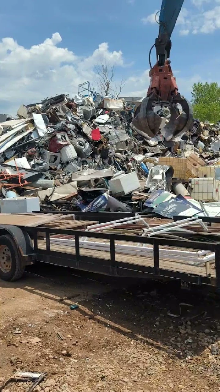 Scrap metal being lifted at Al's Metal Recycling.