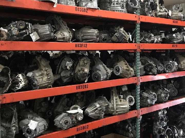 Shelves filled with truck parts and transmissions.