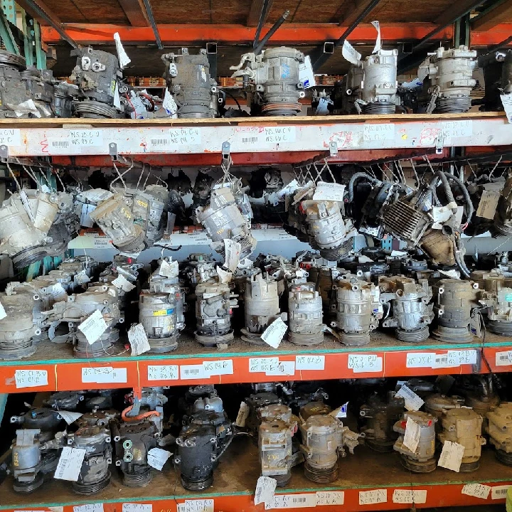 Shelves filled with used auto parts and components.