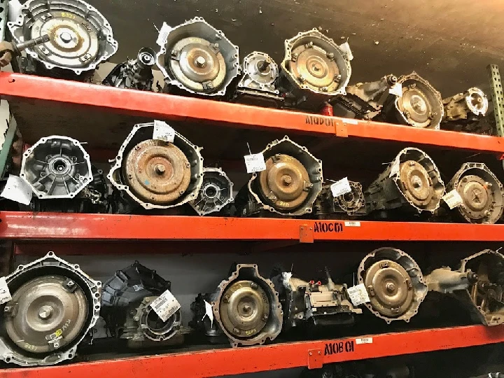 Shelves of truck parts and transmissions at Al's.