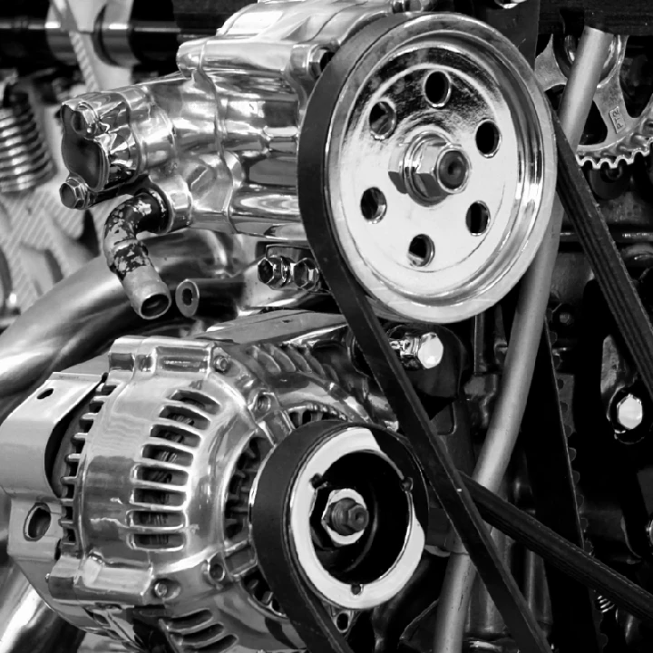 Shiny automotive engine components close-up.