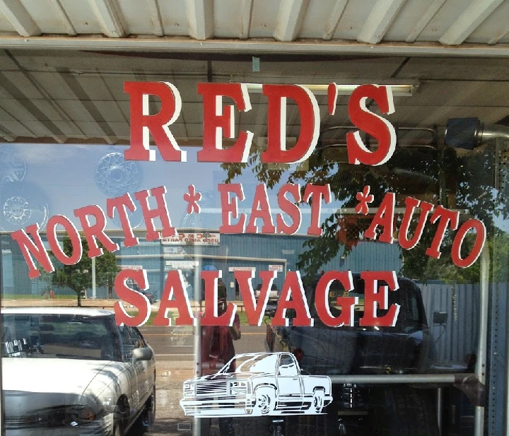 Sign for Red's Northeast Auto Salvage.