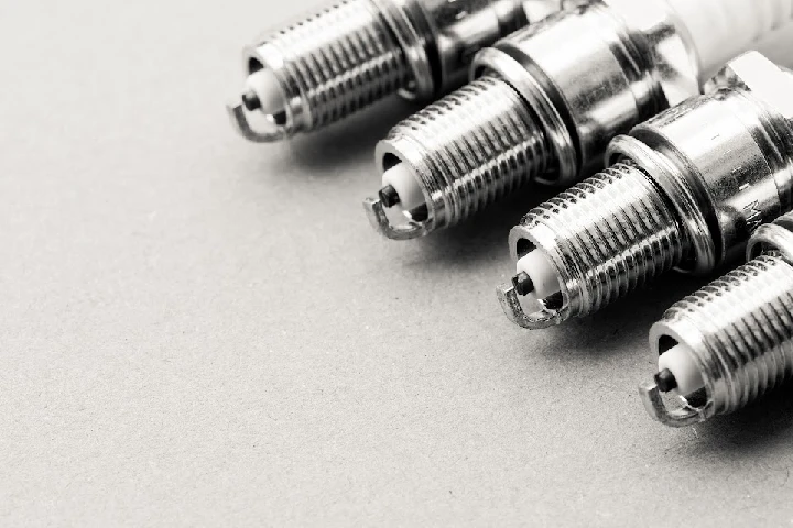 Spark plugs on a gray background.