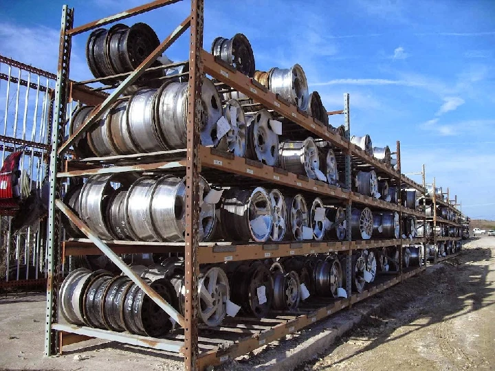 Stacked metal wheels on shelving at A1 Parts Mart.