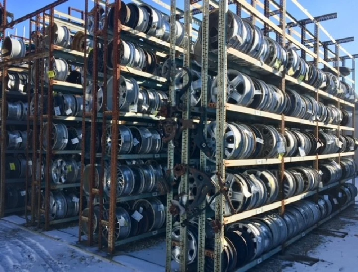 Stacked rims at Riverbend Recycled Auto Parts.