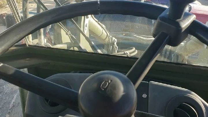 Steering wheel view from a vehicle's cabin.