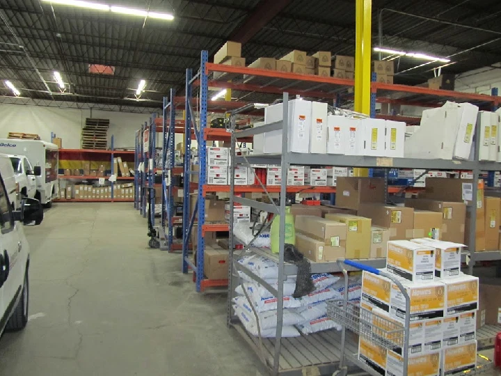 Storage area filled with boxes and shelves.