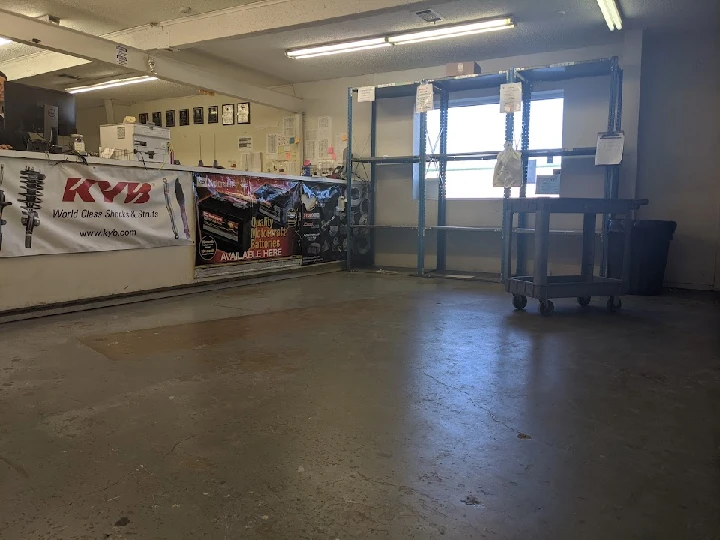 Store interior with banners and shelves.