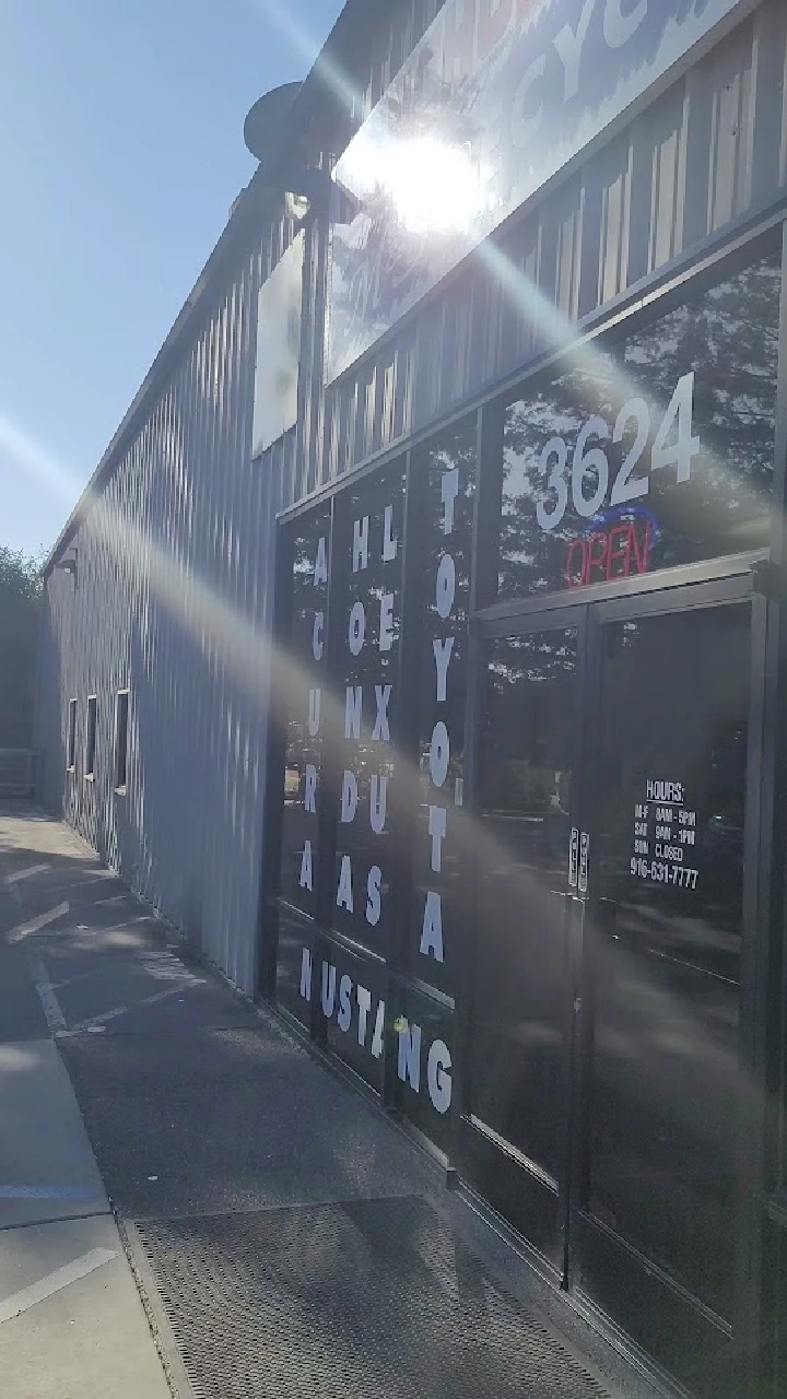 Storefront of Rancho Toyota-Ford Recycling, open hours.