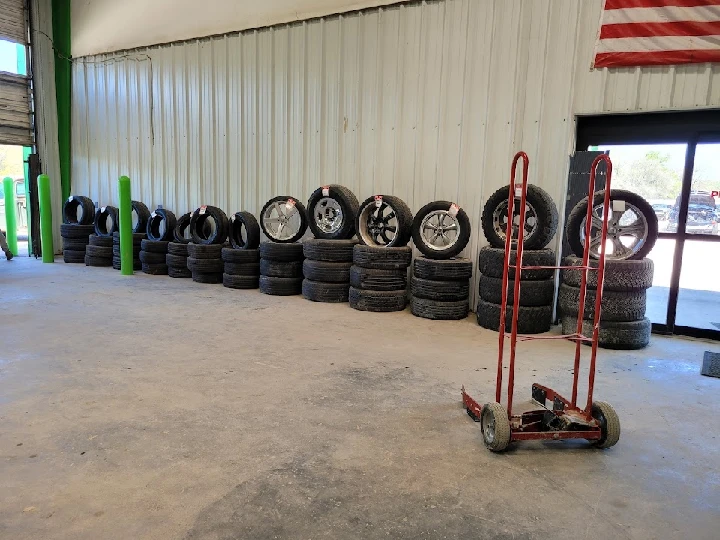 Tires stacked inside BYOT Auto Parts in Beaumont, TX.