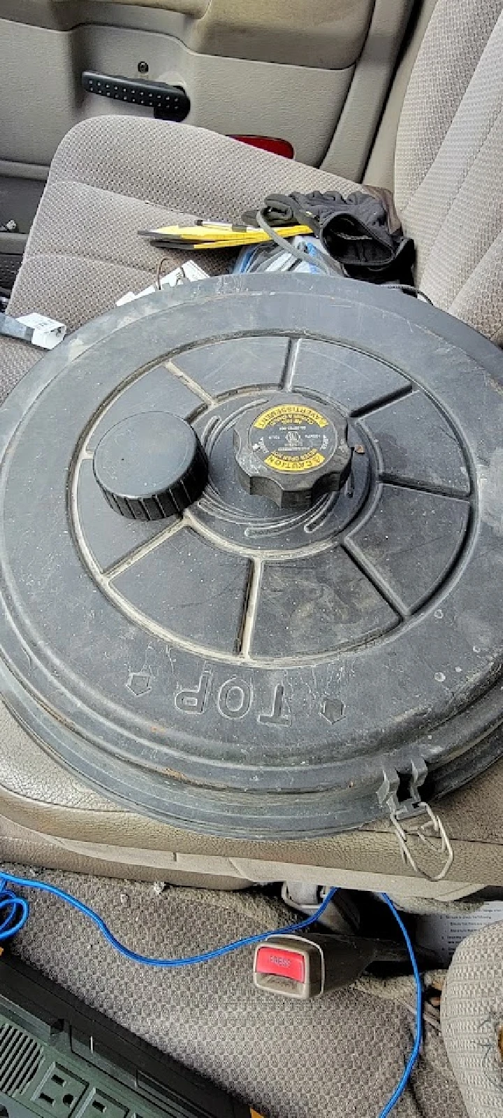 Truck part on a car seat, labeled TOP.