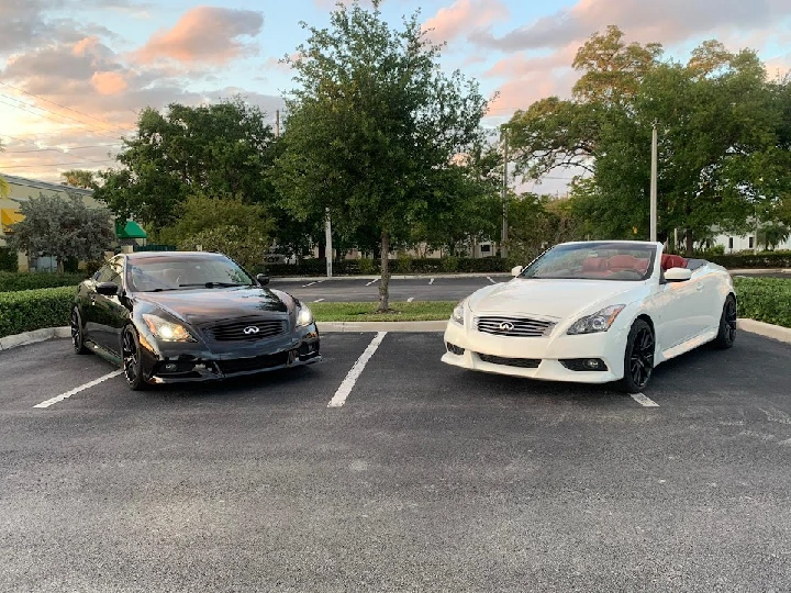 Two Infiniti cars parked side by side.