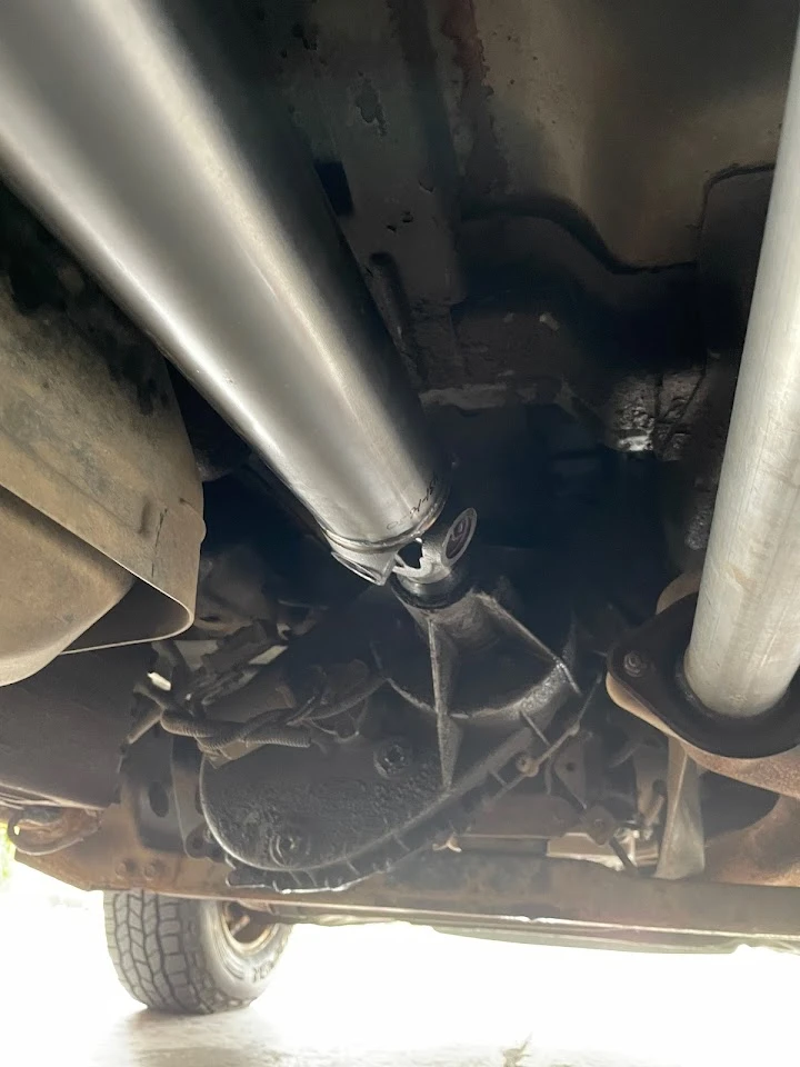 Underbody view of a vehicle's exhaust system.