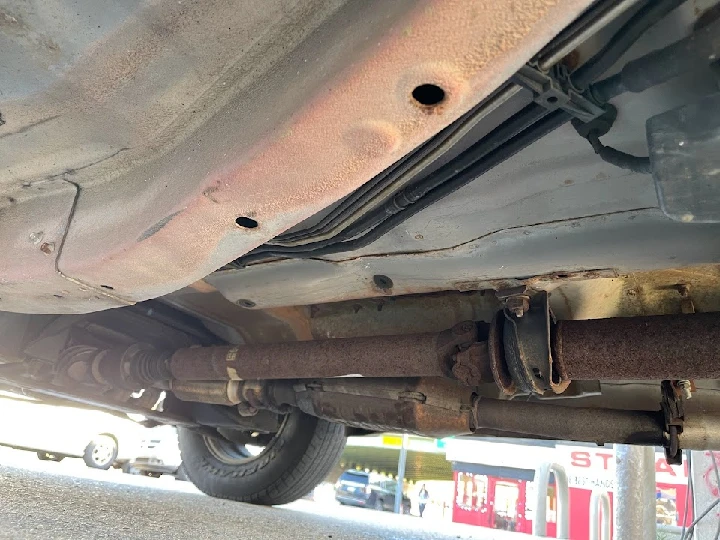 Underneath view of a vehicle's undercarriage.