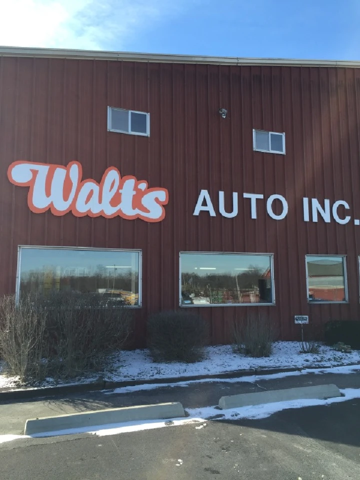 Walt's Auto Inc. storefront with windows and signage.