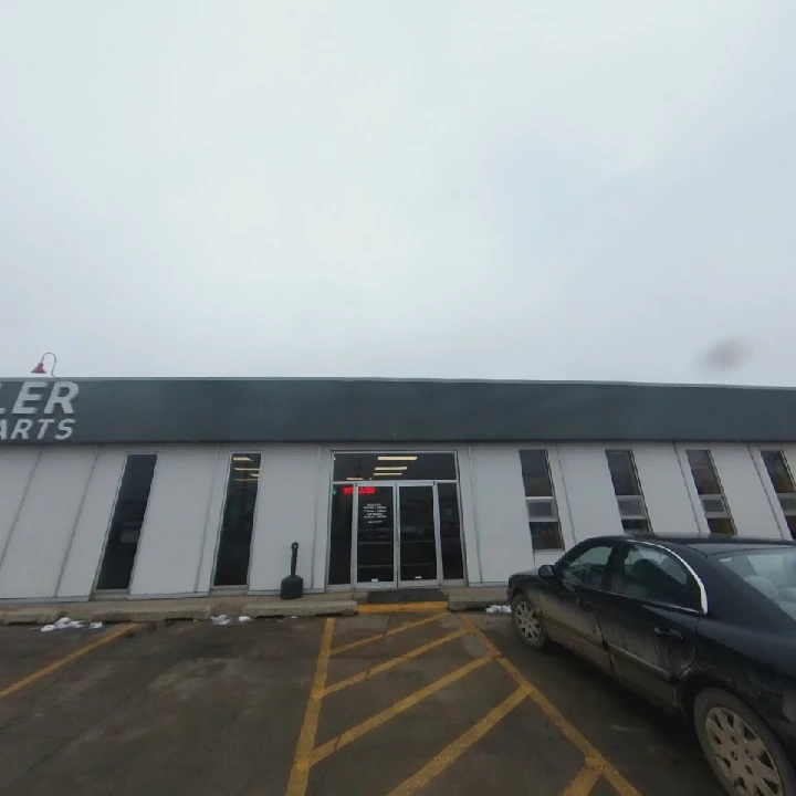 Weller Auto Parts storefront on a cloudy day.