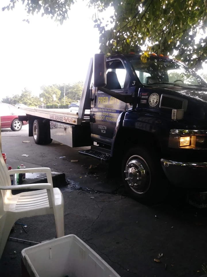 Wrecker truck parked, ready for service.