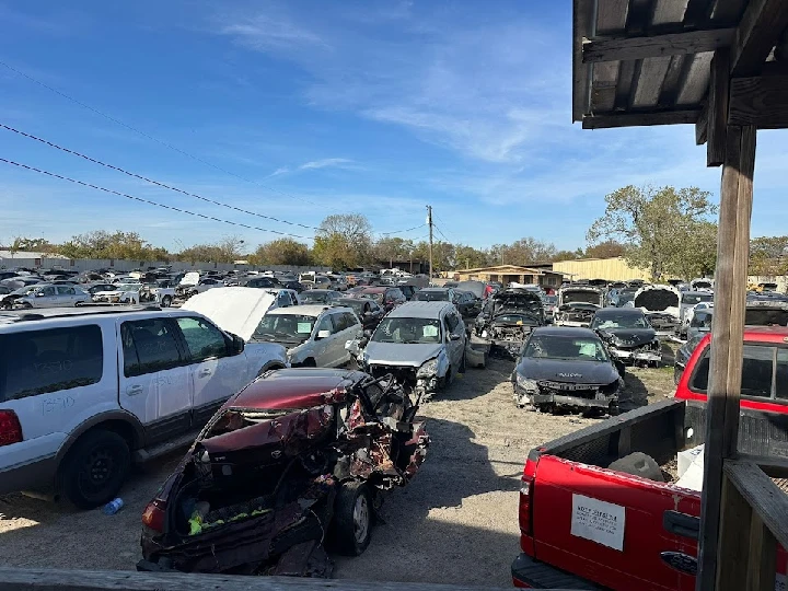 Abandoned cars in a recycling yard.