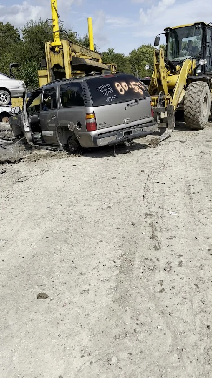 Abandoned vehicle at an auto salvage yard.