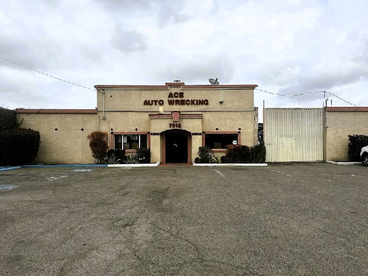 Ace Auto Wrecking building and parking lot view.