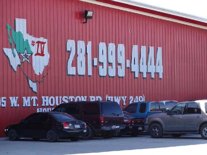 All American Auto Salvage location with parked cars.