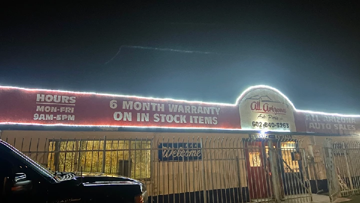 All Arizona Auto Parts store exterior at night.