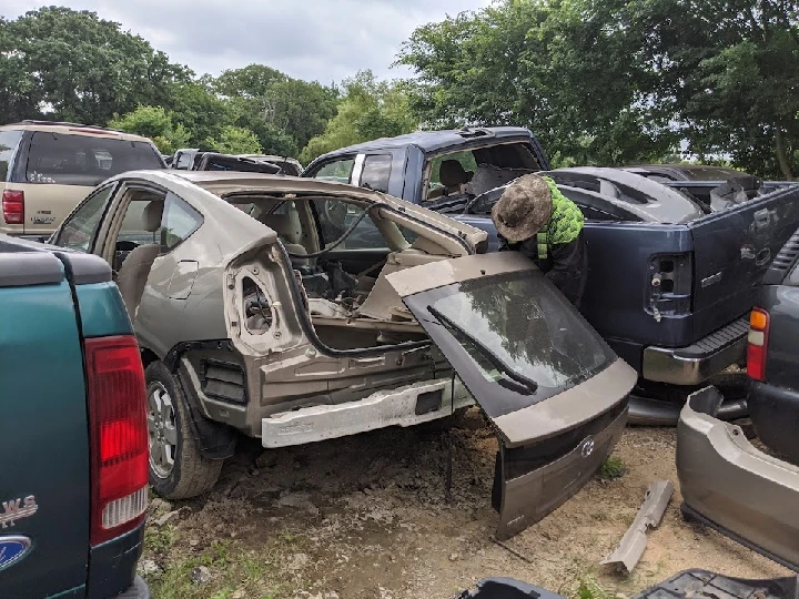 Auto parts being salvaged in a junkyard.