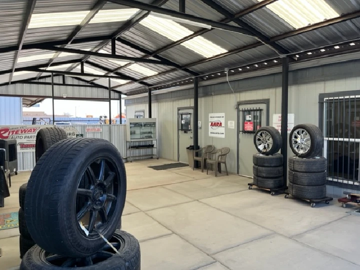 Auto parts store interior with stacked tires.