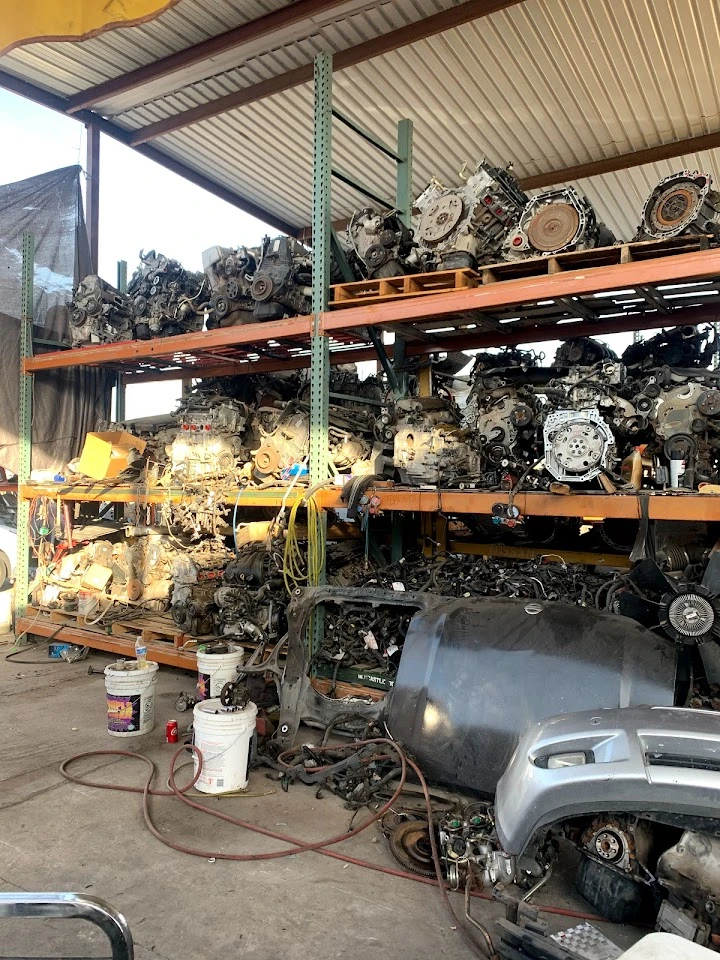 Auto parts warehouse filled with engines and parts.