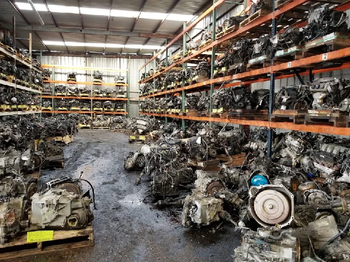 Auto parts warehouse filled with various engines.