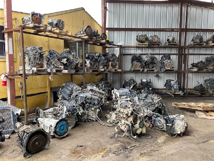 Auto salvage yard with various car engines.