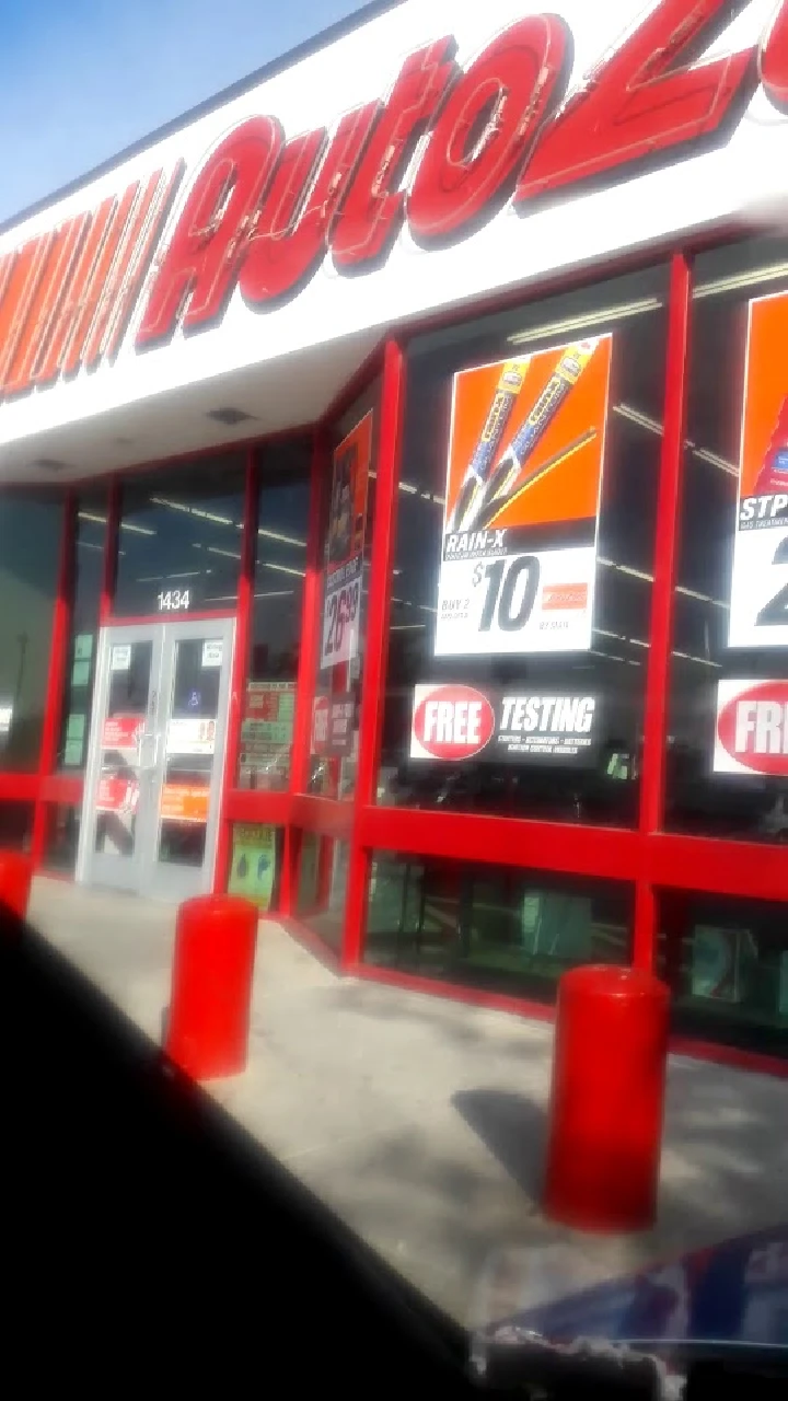 AutoZone store front with promotions displayed.