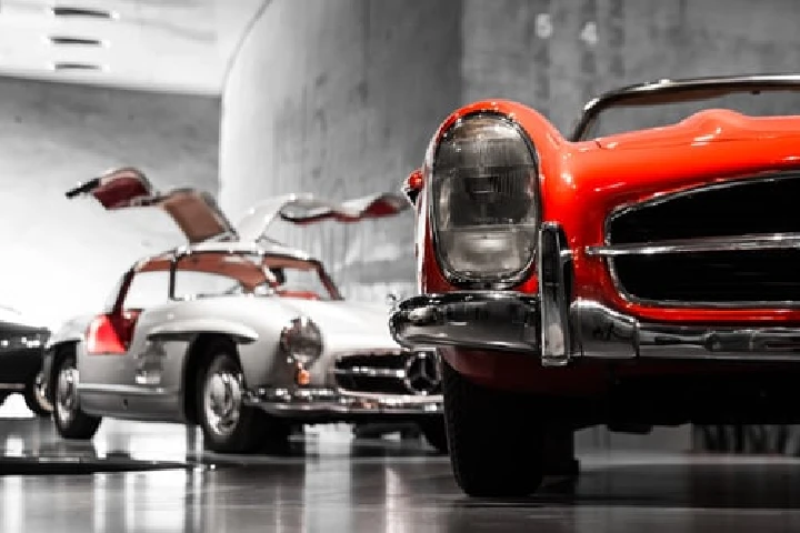 Classic cars on display at a showroom.