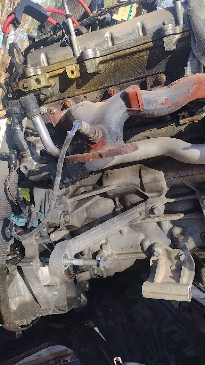 Close-up of engine components at auto salvage yard.