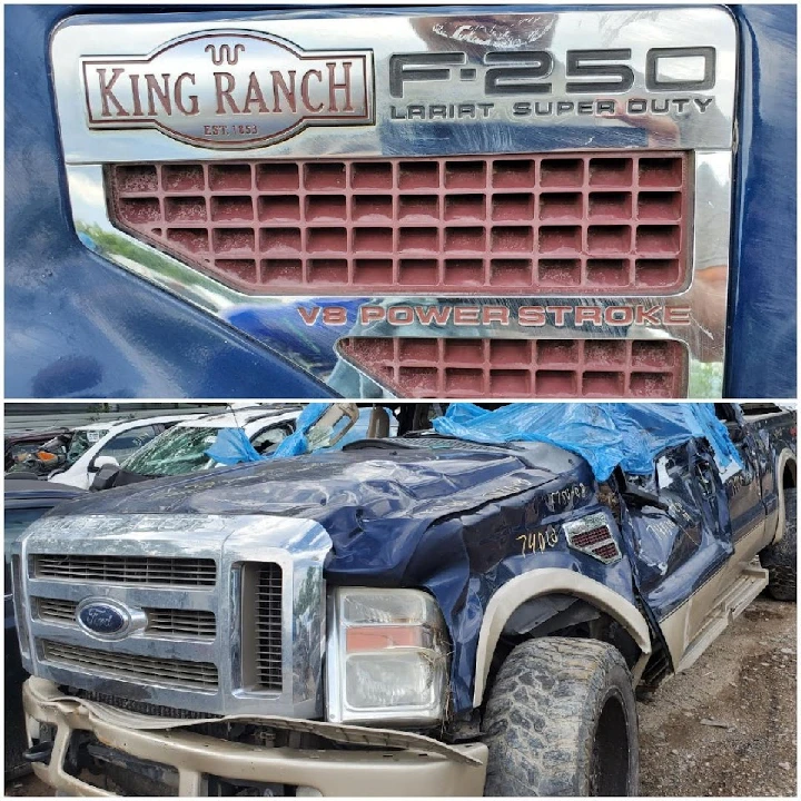 Damaged Ford F-250 truck at auto salvage yard.