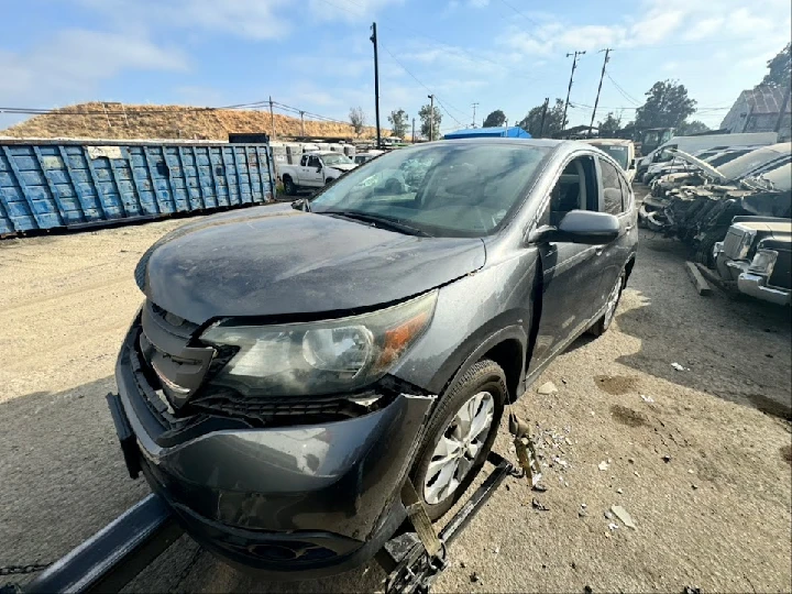 Damaged vehicle at A1 Auto Wreckers lot.