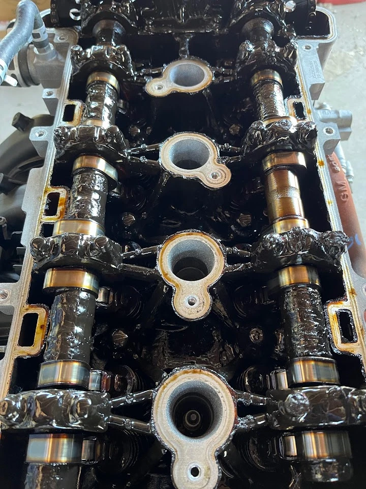 Engine components close-up, showcasing camshafts.