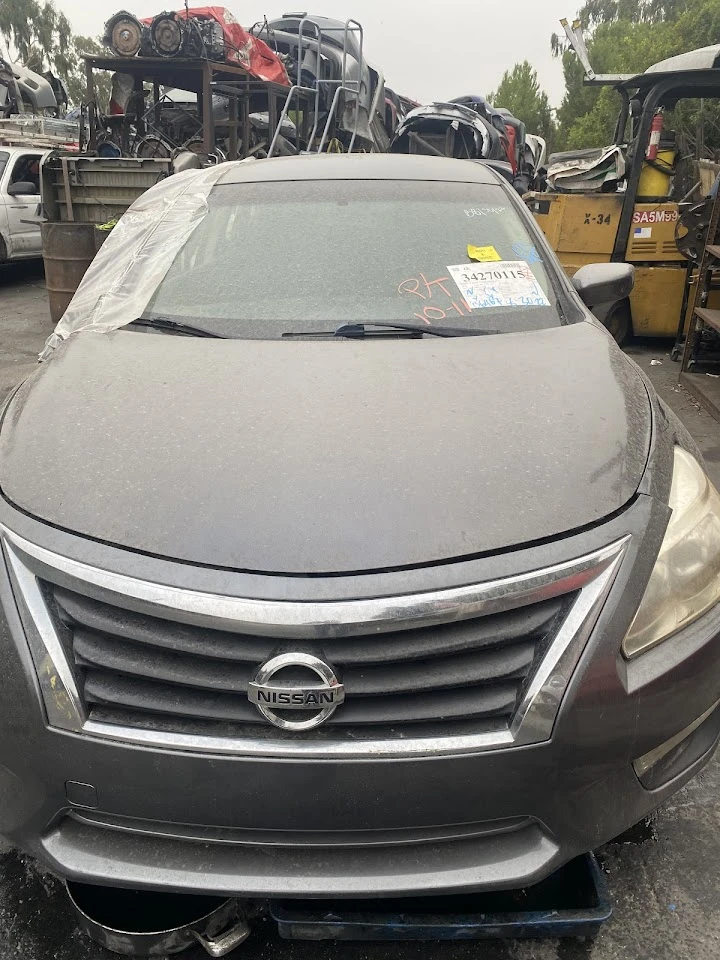 Nissan car at Motor City Auto Wrecking yard.