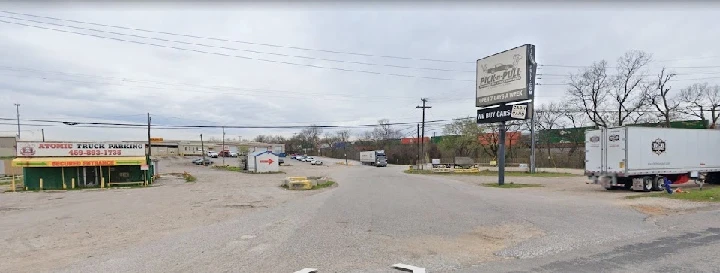 Pick-n-Pull location with trucks and signage.