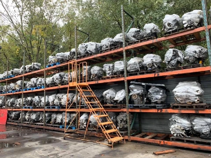 Stocked auto engines on shelves at a salvage yard.