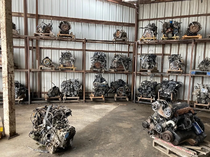 Storage area with various used car engines.