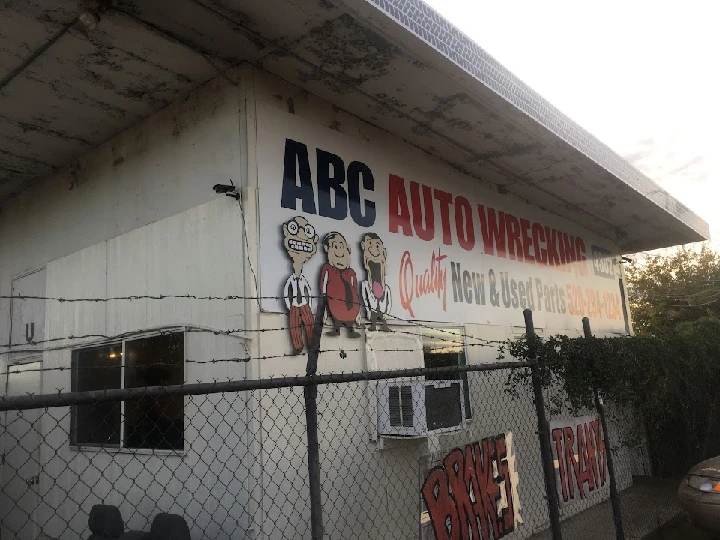 ABC Auto Wrecking exterior with colorful signage.