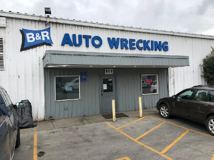 B&R Auto Wrecking storefront with parking area.