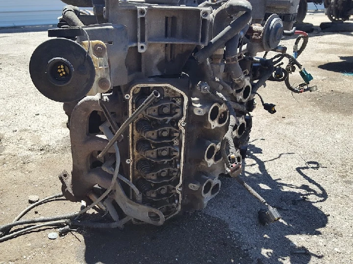 Engine assembly on a concrete surface.