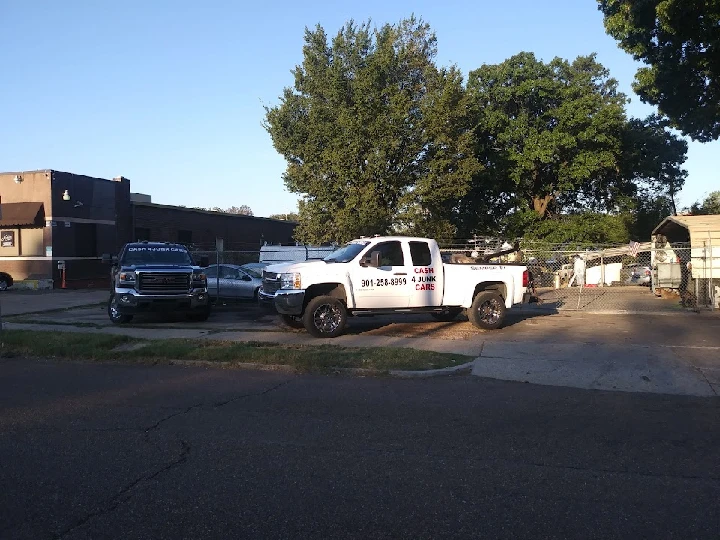 Memphis Cash for Junk Cars site with parked trucks.