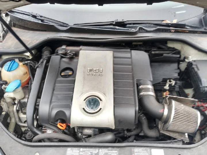 Volkswagen FSI turbo engine in a vehicle's hood.